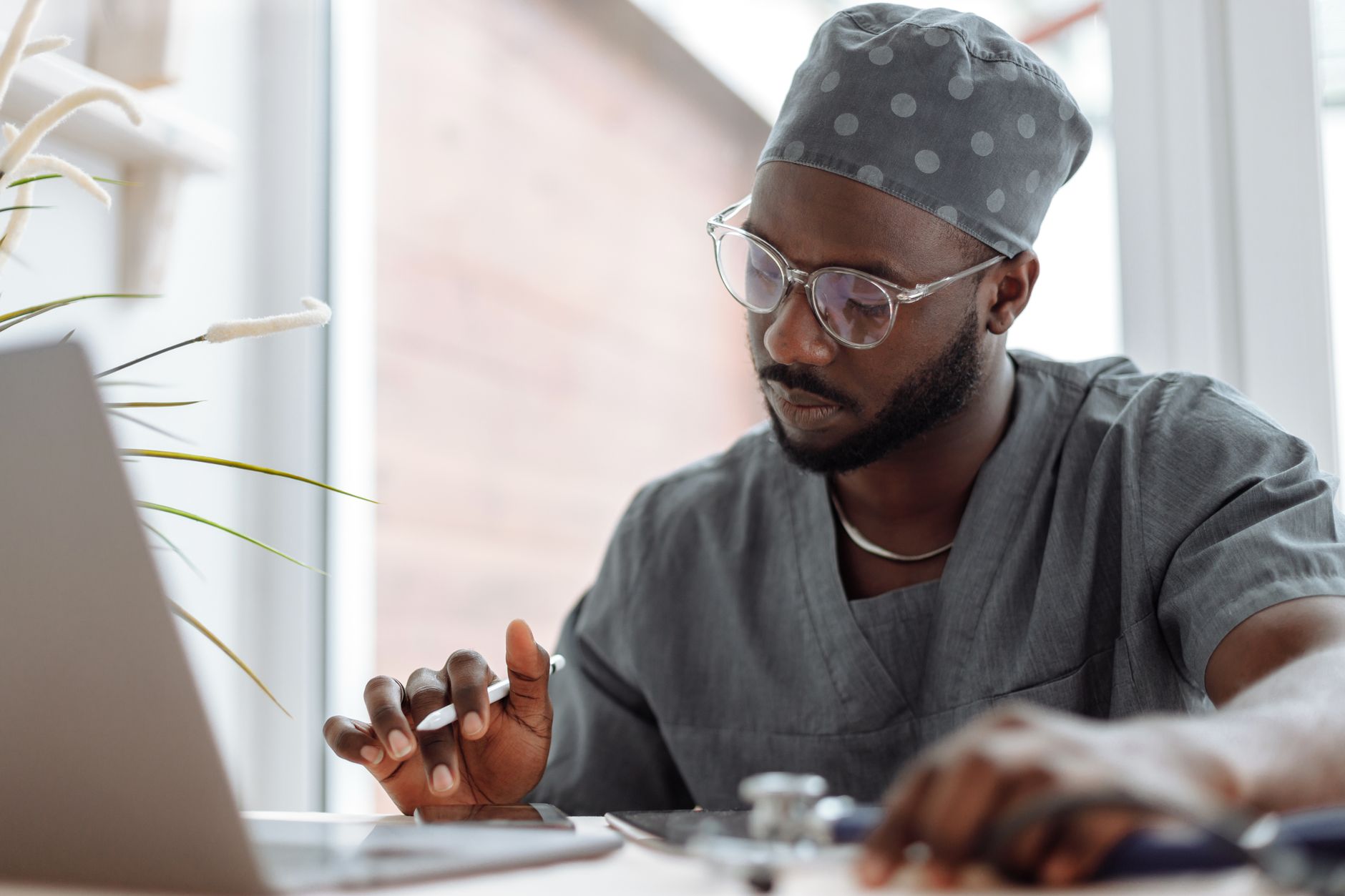 Healthcare professional using self-service BI tool to build patient outcome dashboard
